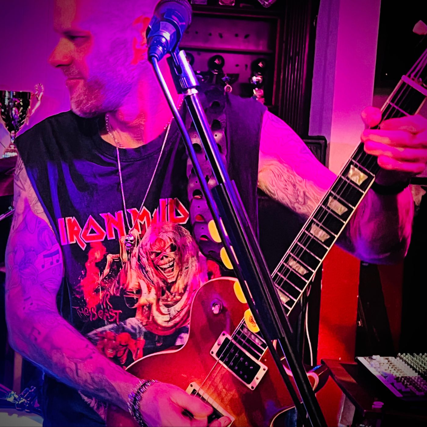 Guitarist performing live wearing the FINAL LAUGH skull pendant by ROCKSTAR★REFINEMENTS.