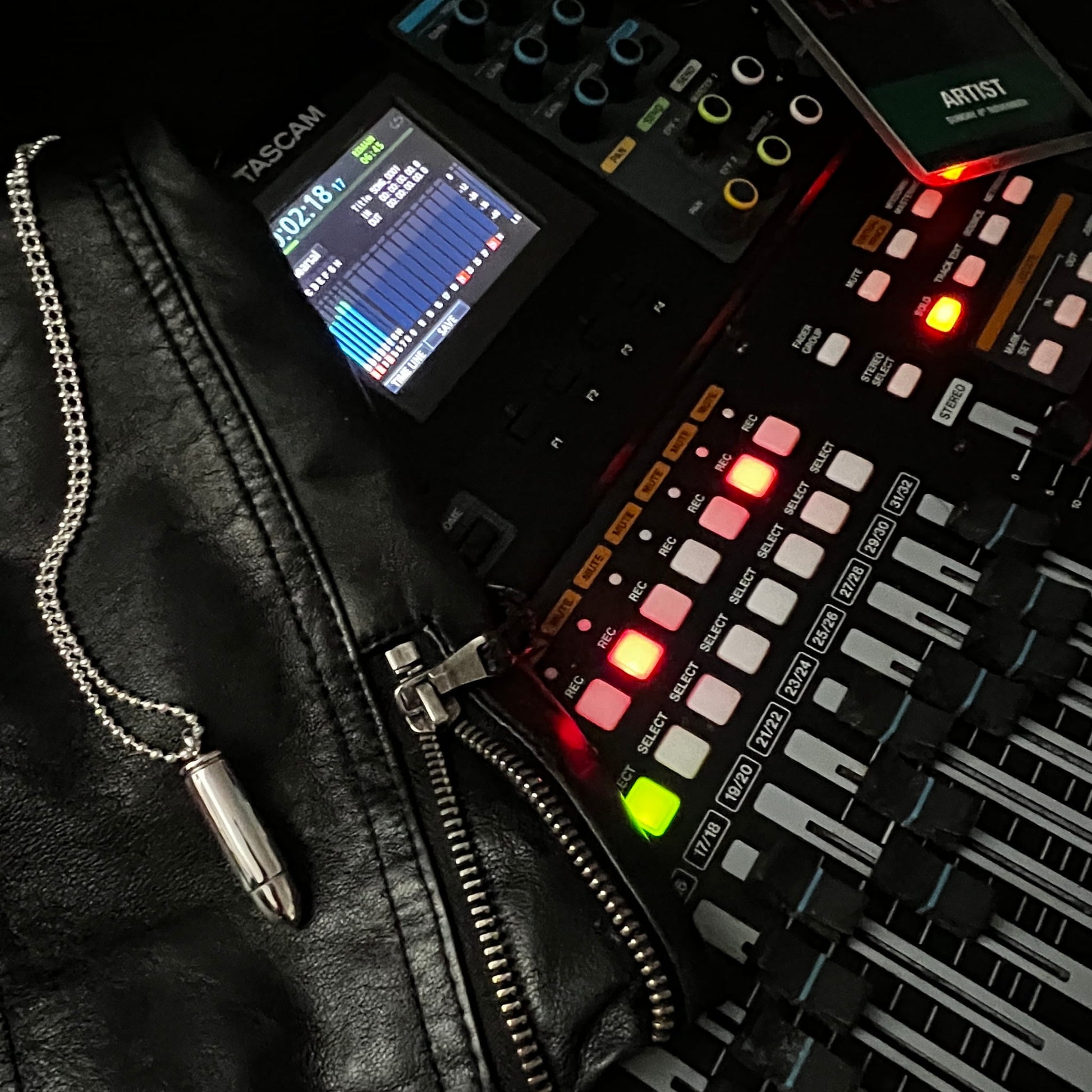 Sterling silver One Hit Wonder locket pendant styled on a recording desk with faders