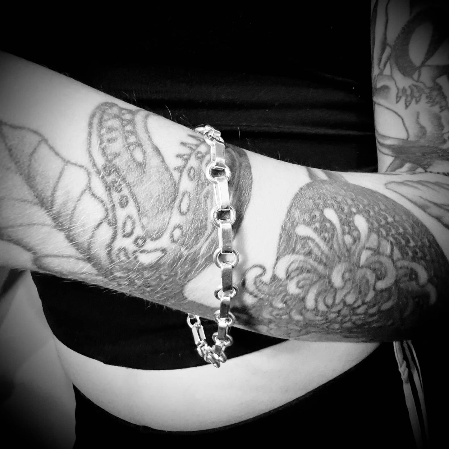 Female wearing BACKLINE sterling silver bracelet by ROCKSTAR★REFINEMENTS™