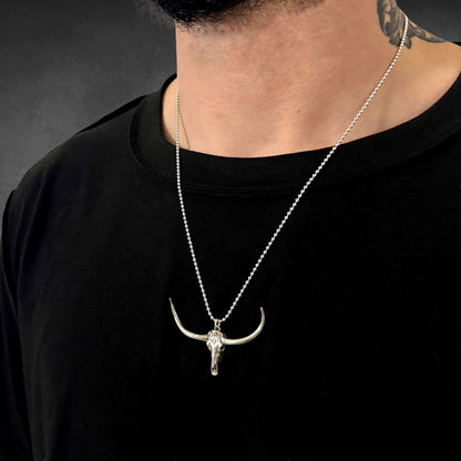 DON'T SQUAT WITH YER SPURS ON on 24 inch ball chain, photographed on male model 