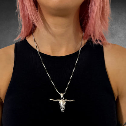 POINT OF NO RETURN worn by  female model on 22 inch oxidised 2.5mm ball chain, photographed on grey backdrop