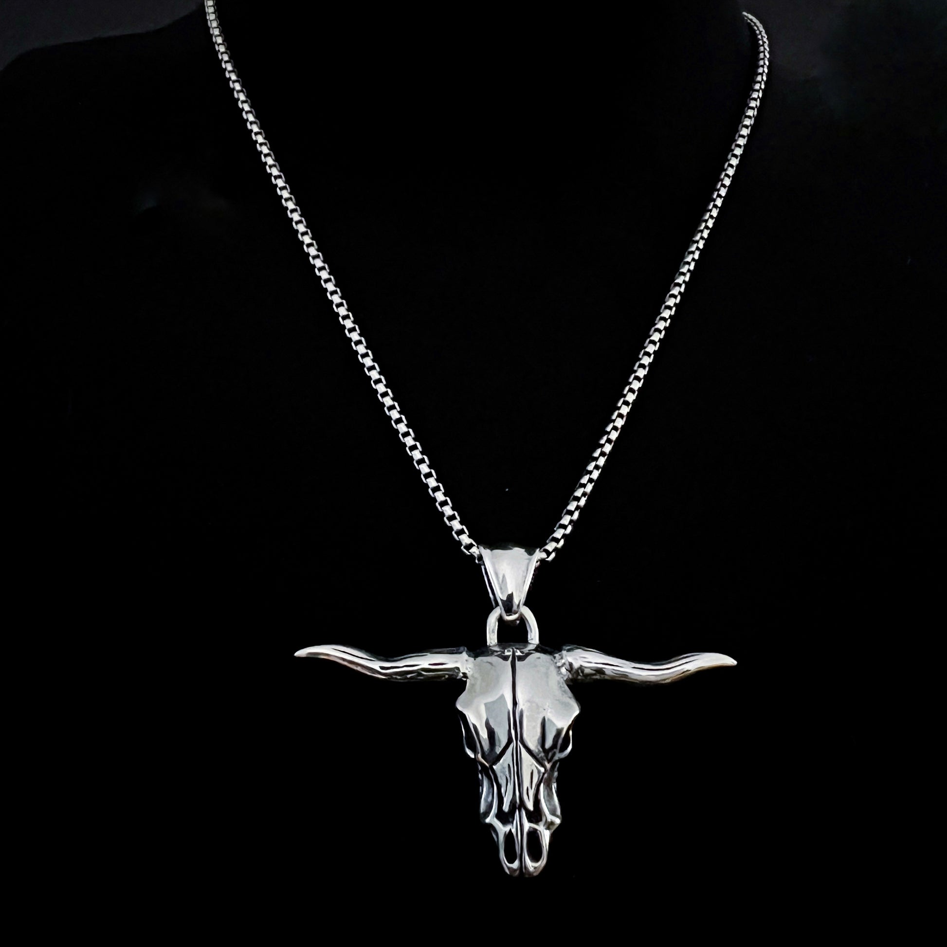 Sterling silver Point of No Return longhorn skull pendant from ROCKSTAR★REFINEMENTS, on a 18 inch box chain, on black background