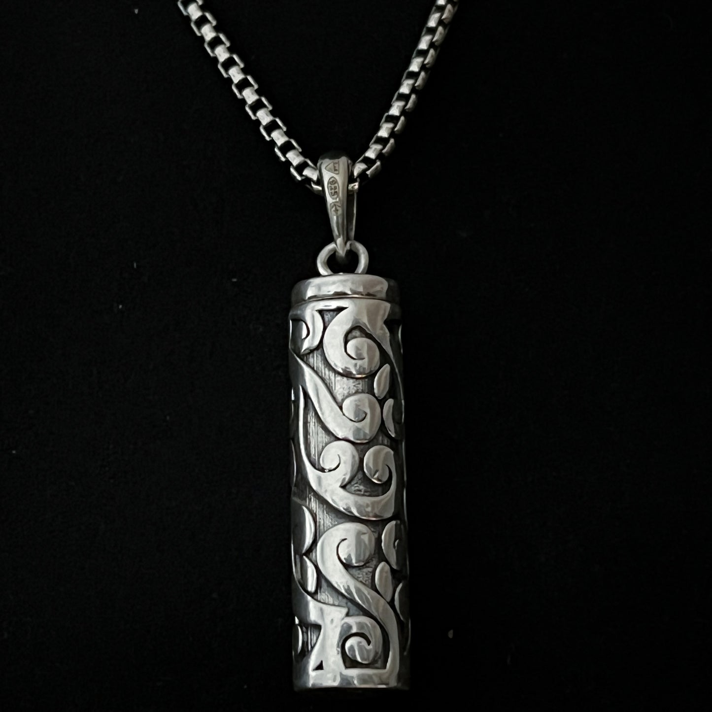 Sterling silver POISON IS THE CURE locket pendant close up