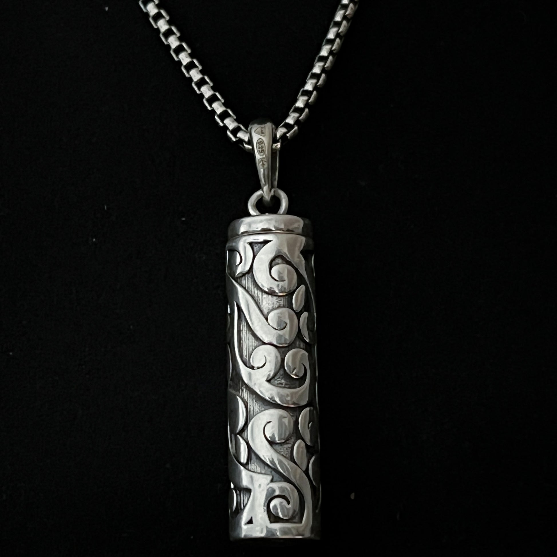 Sterling silver POISON IS THE CURE locket pendant close up
