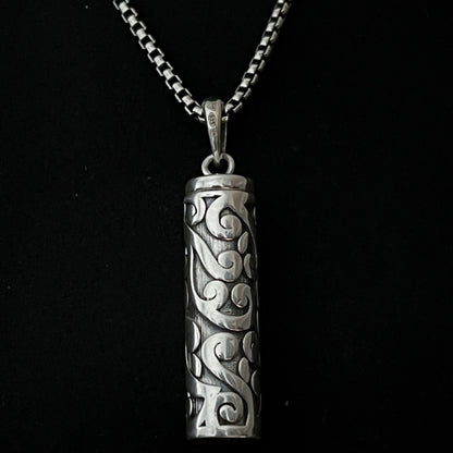Sterling silver POISON IS THE CURE locket pendant close up