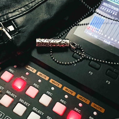 Sterling silver Poison is the Cure locket pendant in the recording studio