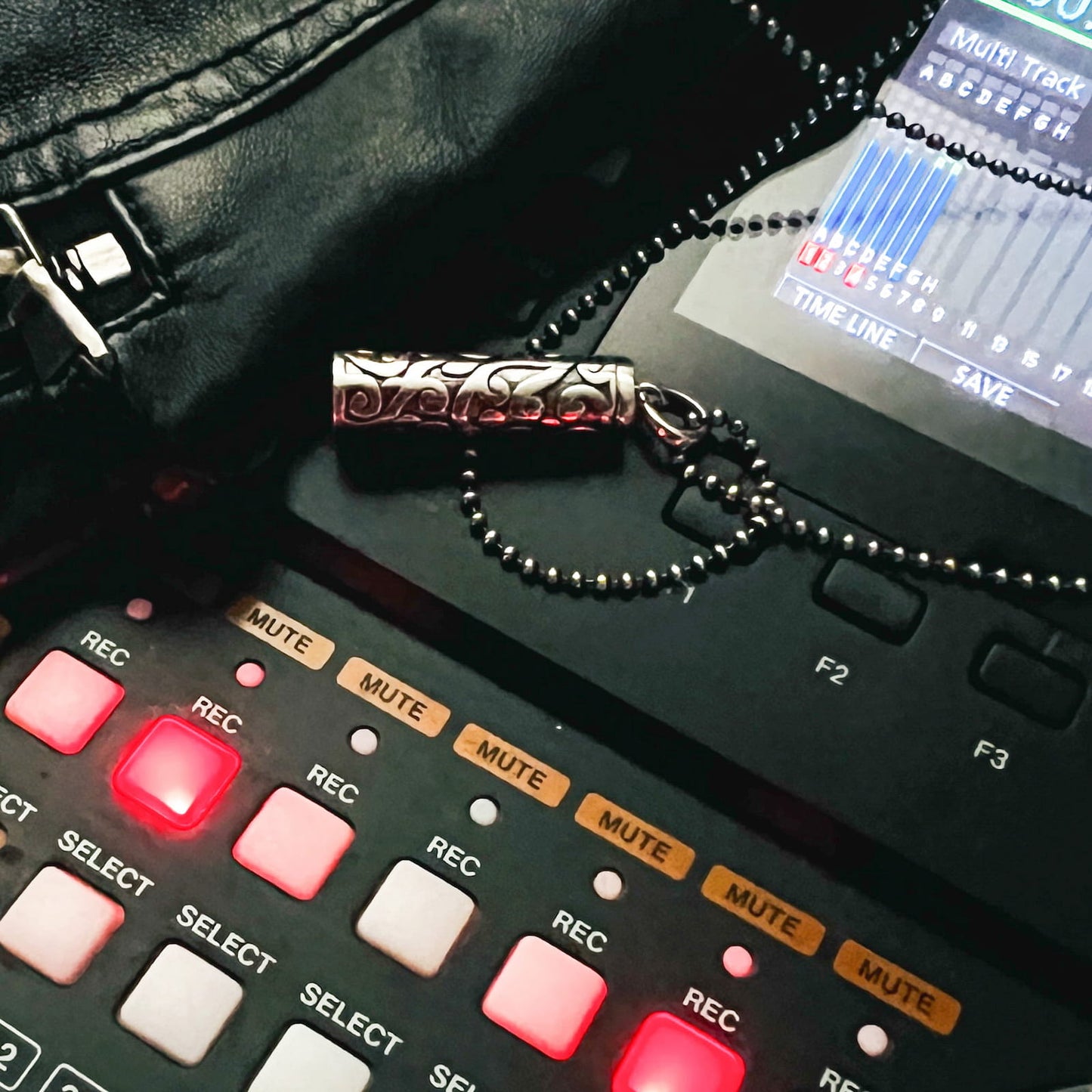 Sterling silver Poison is the Cure locket pendant in the recording studio