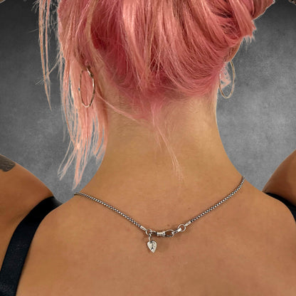 Rear view showing clasp detail on POISON IS THE CURE worn by  female model