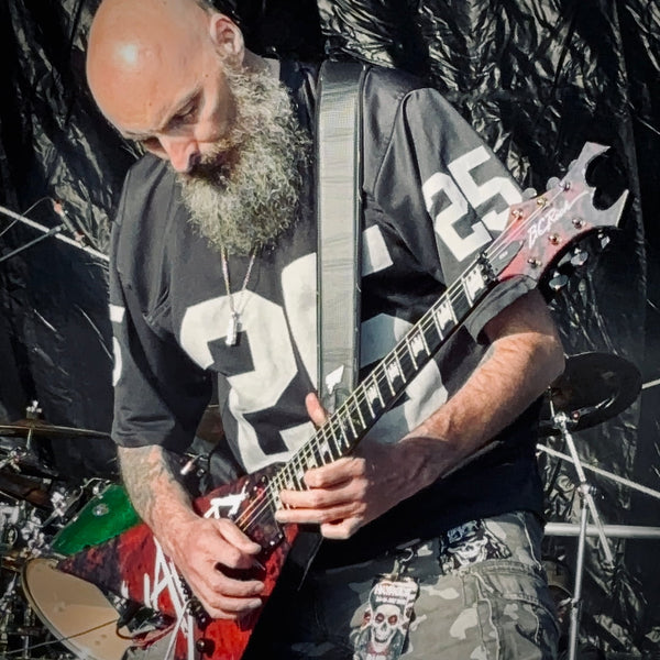 Stuart "Rage" Dixon performing with Live Undead, wearing the ROCKSTAR★REFINEMENTS™ 'ANTIDOTE (NOT INCLUDED) pendant on stage.