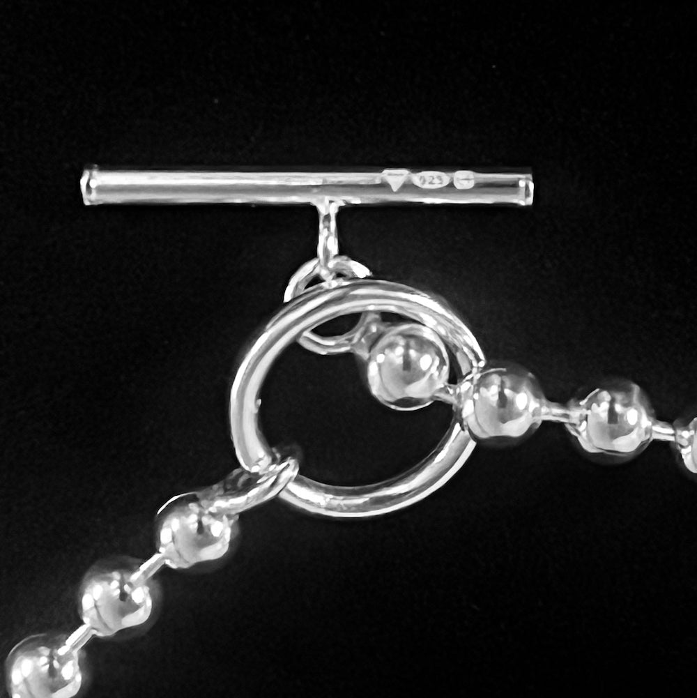 Close-up of official 925 hallmark and R★R maker’s mark stamped on a sterling silver bracelet from ROCKSTAR★REFINEMENTS™