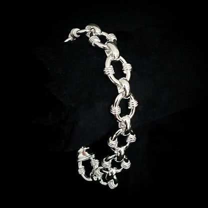 AFTERPARTY sterling silver link bracelet on black background by ROCKSTAR★REFINEMENTS™
