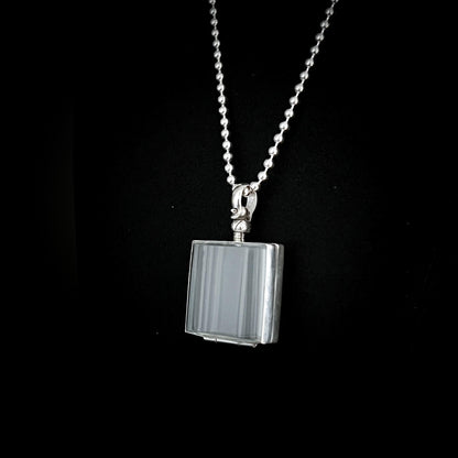 Rectangular glass and sterling silver pendant necklace on a black background – ASHES OF HIS HOODIE by ROCKSTAR★REFINEMENTS
