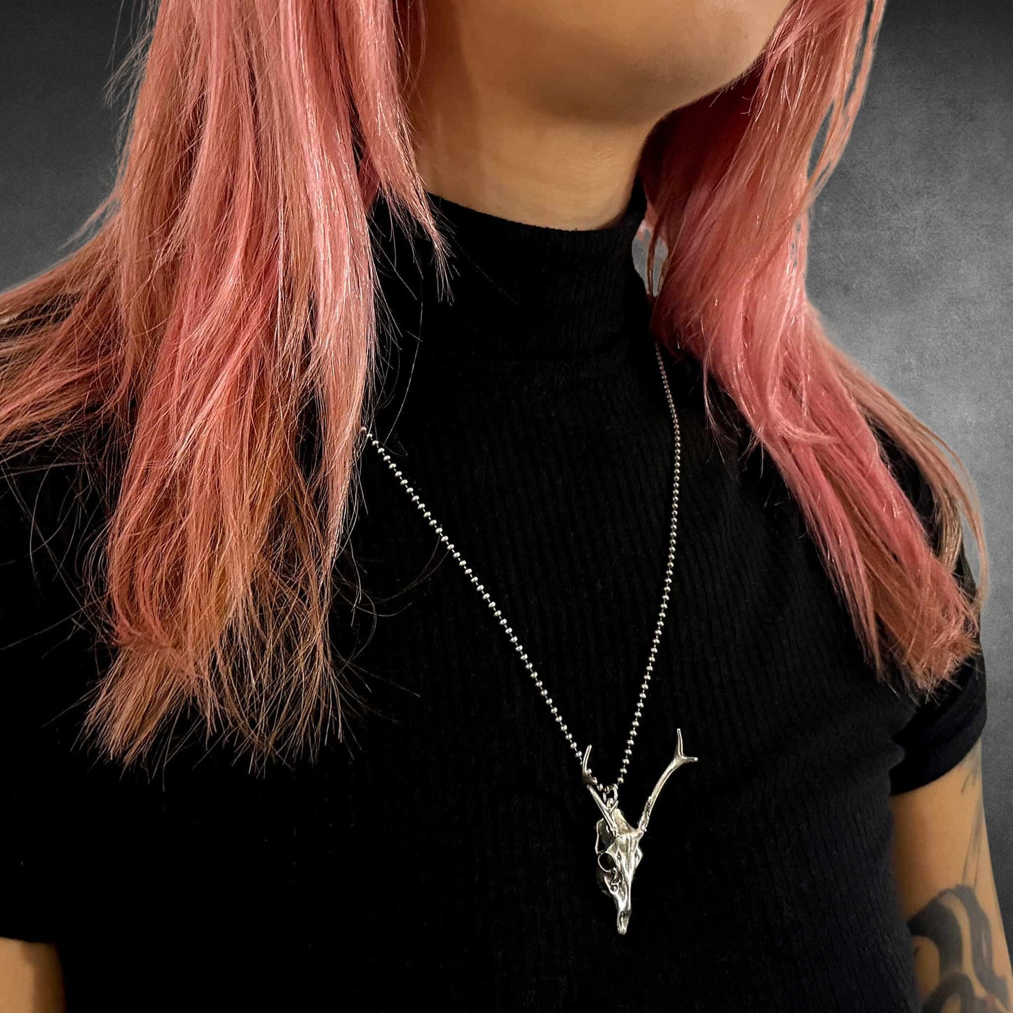 FAWN OF THE DEAD sterling silver deer pendant on 24-inch oxidised ball chain on female model