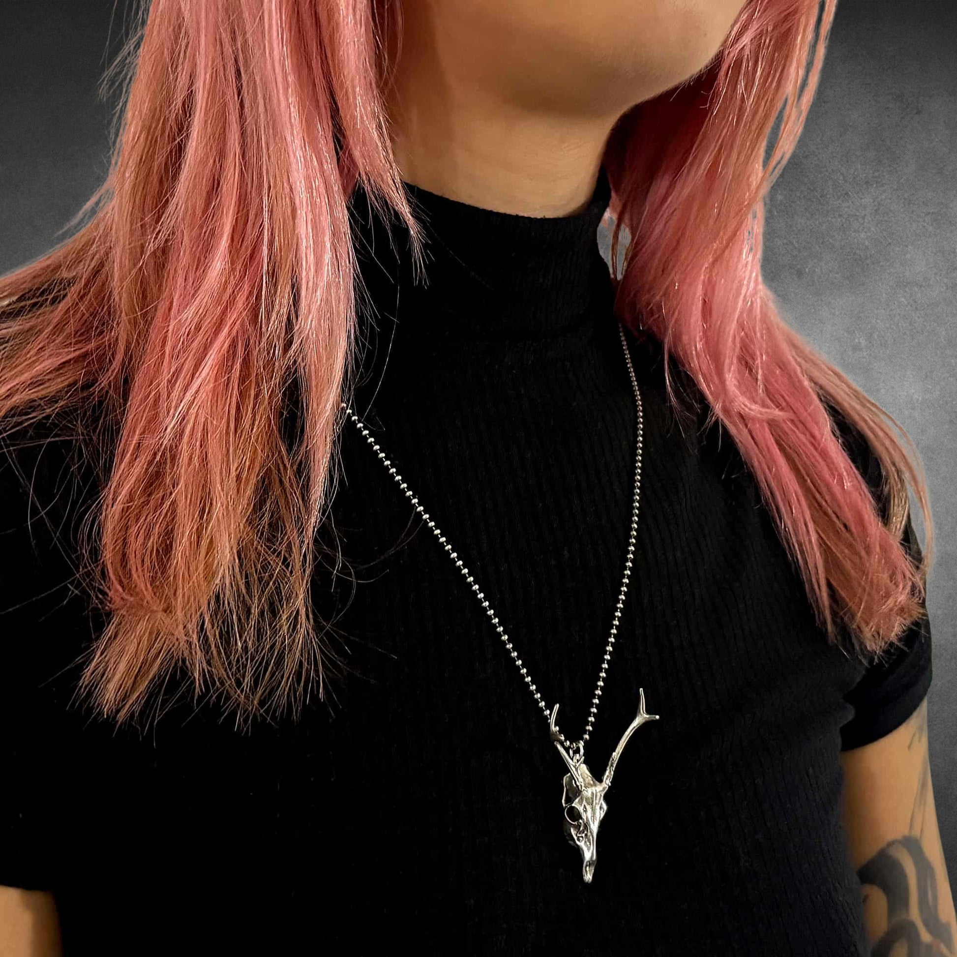 FAWN OF THE DEAD sterling silver deer pendant on 24-inch oxidised ball chain on female model