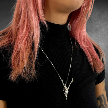 FAWN OF THE DEAD sterling silver deer pendant on 24-inch oxidised ball chain on female model