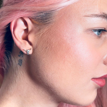 Close up of female wearing BULL HEADED sterling silver earrings by ROCKSTAR★REFINEMENTS™