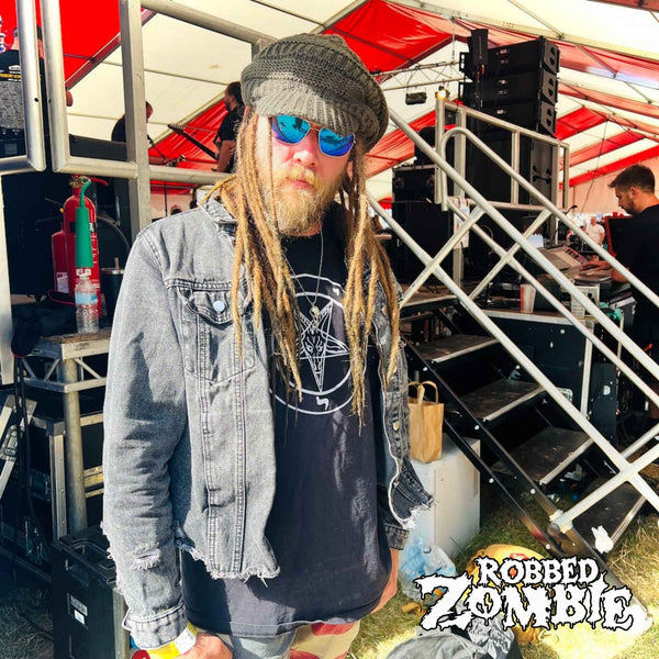 Chris Newman of Robbed Zombie backstage at a festival wearing the ROCKSTAR★REFINEMENTS™ solid silver CROW'D CONTROL crow skull pendant.