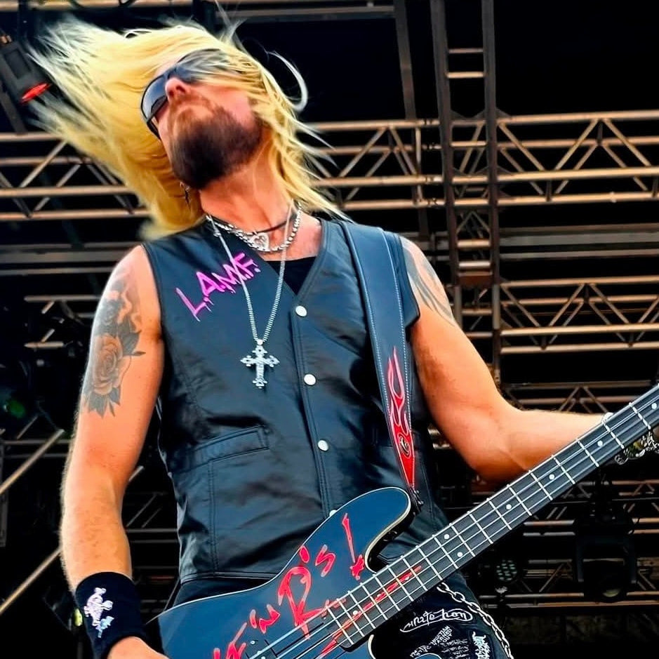 Dermo from Guns or Roses wearing THE OUTLAW'S CROSS on stage
