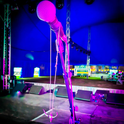 DON'T SQUAT PENDANT HANGING ON MICROPHONE STAND ON STAGE AT A LARGE MUSIC FESTIVAL 