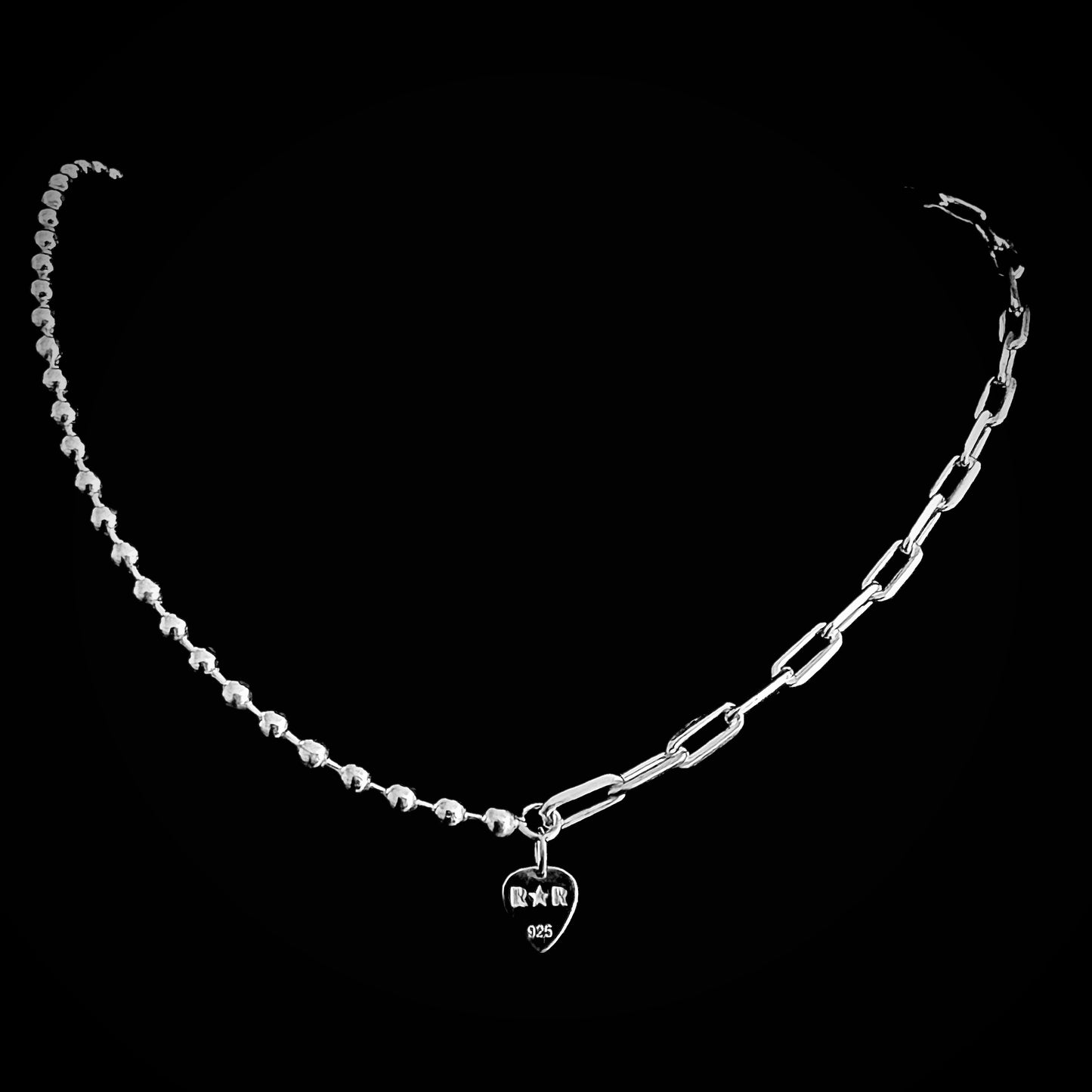 Sterling silver 'CROSSFADE' necklace combining ball chain and paperclip chain — with branded R★R
tag, on black back background.