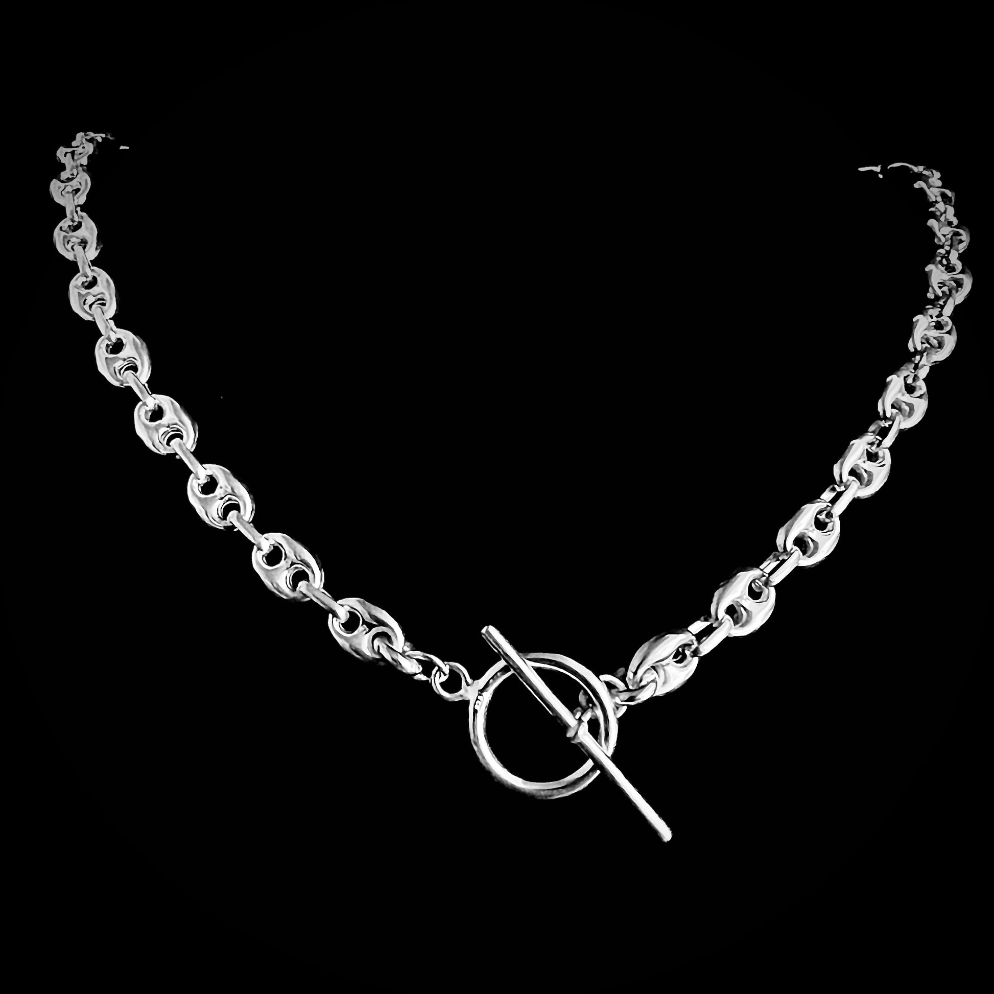 'DEFIANCE' bold anchor chain necklace with toggle bar clasp. Photographed on black background.