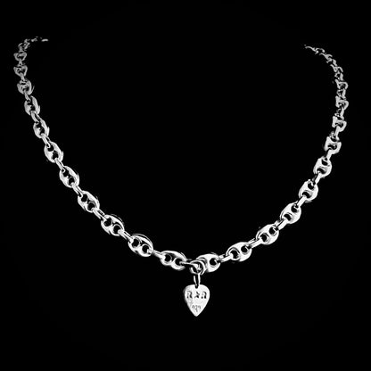 'DEFIANCE' — bold anchor chain necklace. Back of chain showing branded R★R jewellery tag. Photographed on black background.
