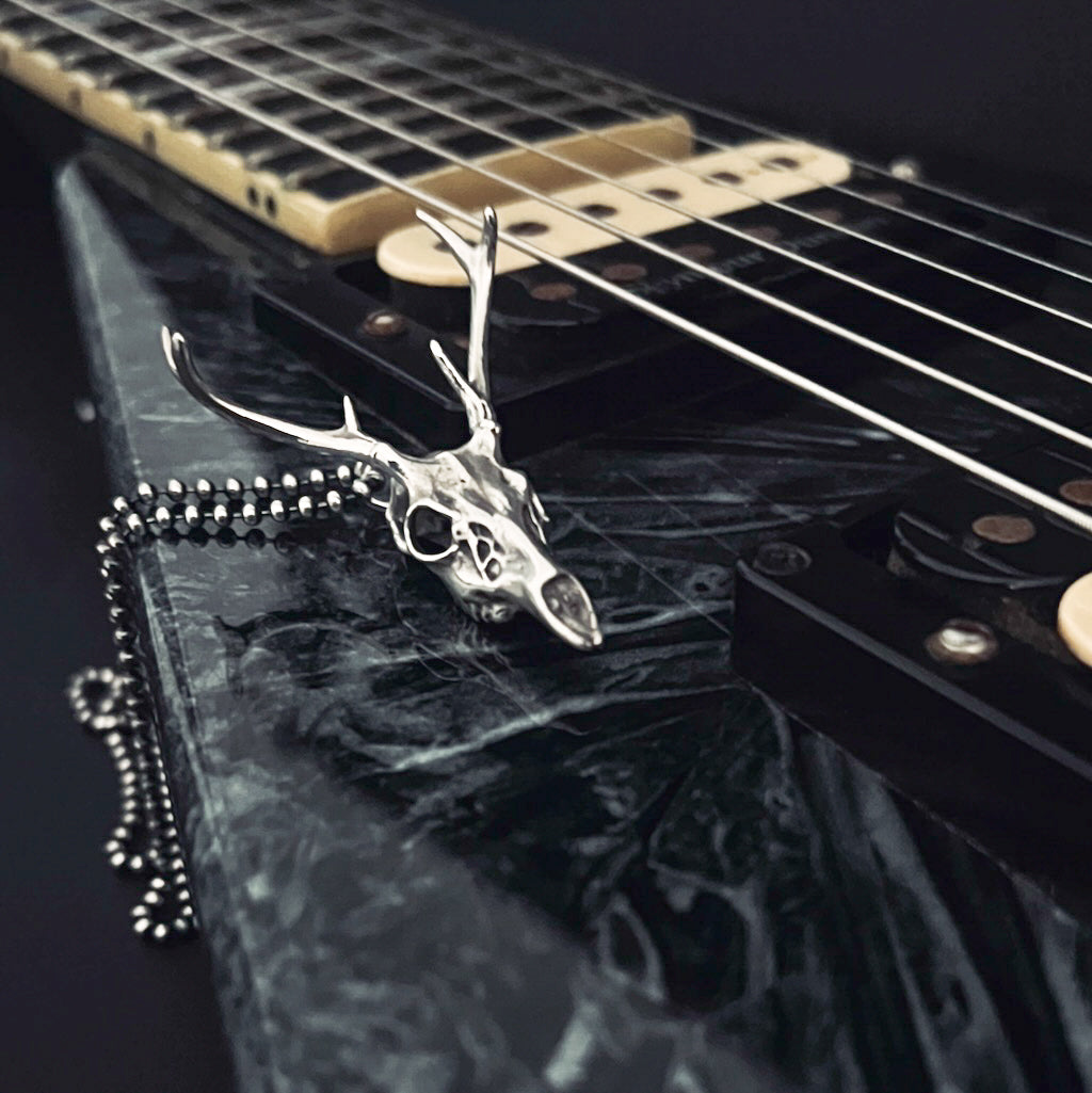 FAWN OF THE DEAD — solid sterling silver pendant on a Jackson V electric guitar by ROCKSTAR★REFINENTS