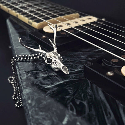 FAWN OF THE DEAD — solid sterling silver pendant on a Jackson V electric guitar by ROCKSTAR★REFINENTS