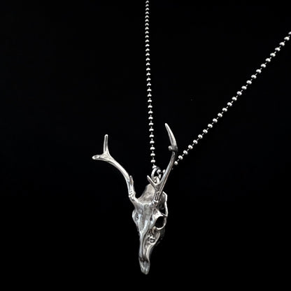 FAWN OF THE DEAD — sterling silver deer skull pendant on an oxidised ball chain, side view, photographed against a black background by ROCKSTAR★REFINEMENTS