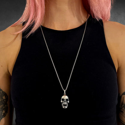 FINAL LAUGH pendant on 26 inch oxidised box chain on female model