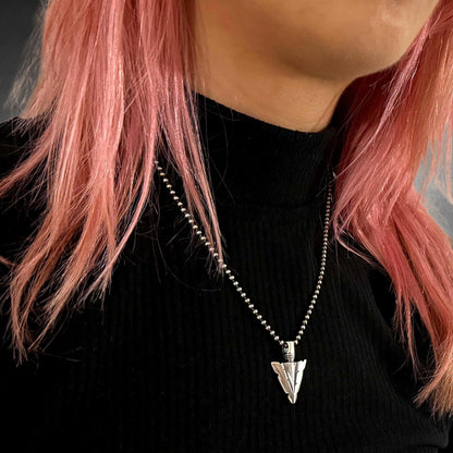 Model wearing FINAL POINT sterling silver arrowhead pendant on 18-inch oxidised ball chain by ROCKSTAR★REFINEMENTS™