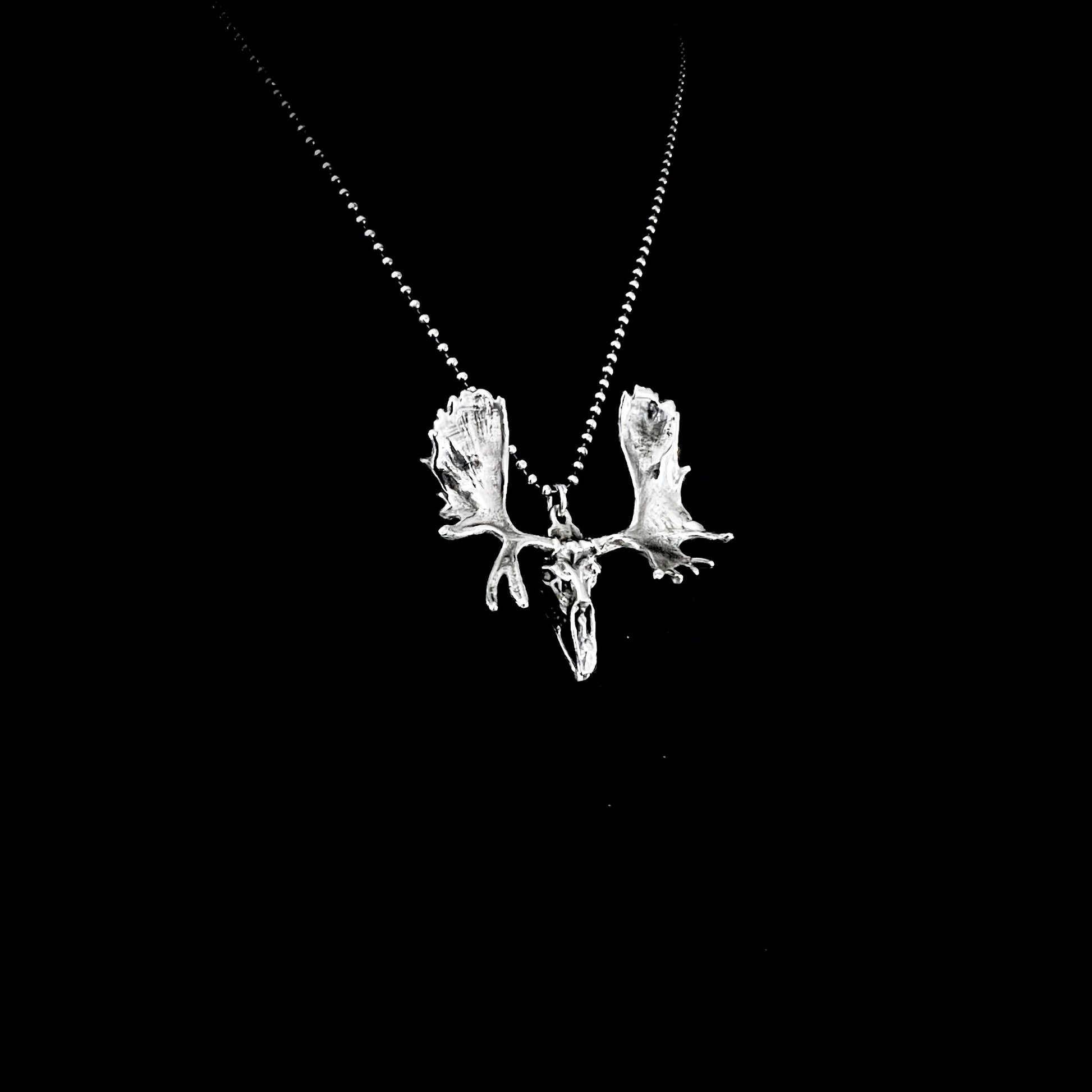 FULL METAL MOOSE — sterling silver moose head pendant with antlers on a 24-inch oxidised ball chain, photographed against a black background by ROCKSTAR★REFINEMENTS