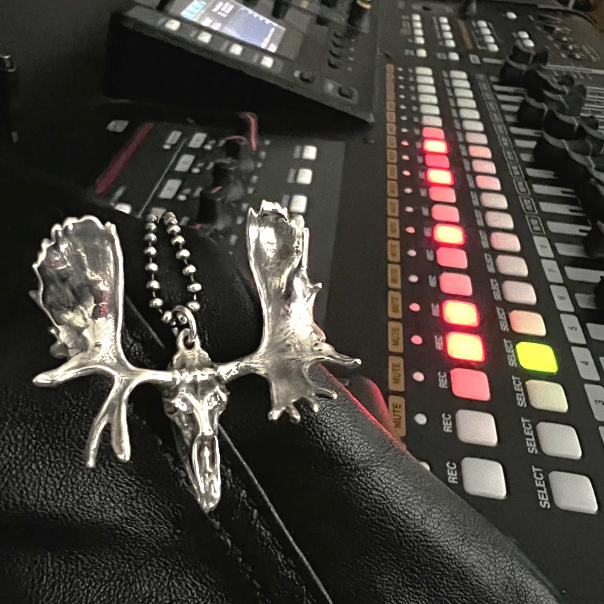 FULL METAL MOOSE — sterling silver moose head pendant with antlers on an oxidised ball chain, photographed in a recording studio by ROCKSTAR★REFINEMENTS