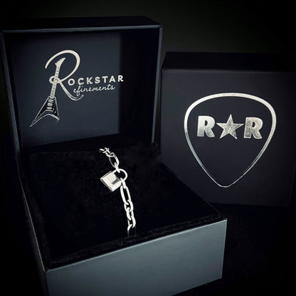LOCKED-IN WRIST CHAIN padlock bracelet displayed in ROCKSTAR★REFINEMENTS™ box. 