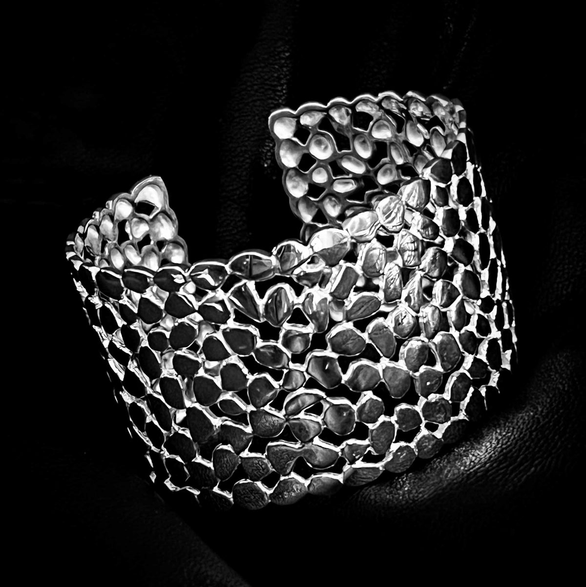 'MAINSTAGE' solid silver statement bangle by ROCKSTAR★REFINEMENTS™ photographed on a black background
