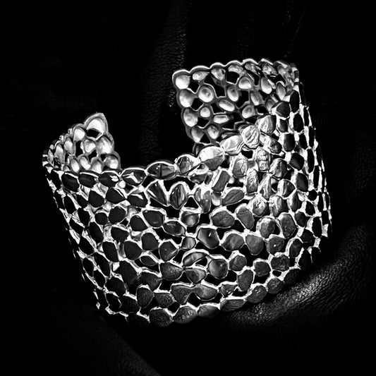 'MAINSTAGE' solid silver statement bangle by ROCKSTAR★REFINEMENTS™ photographed on a black background
