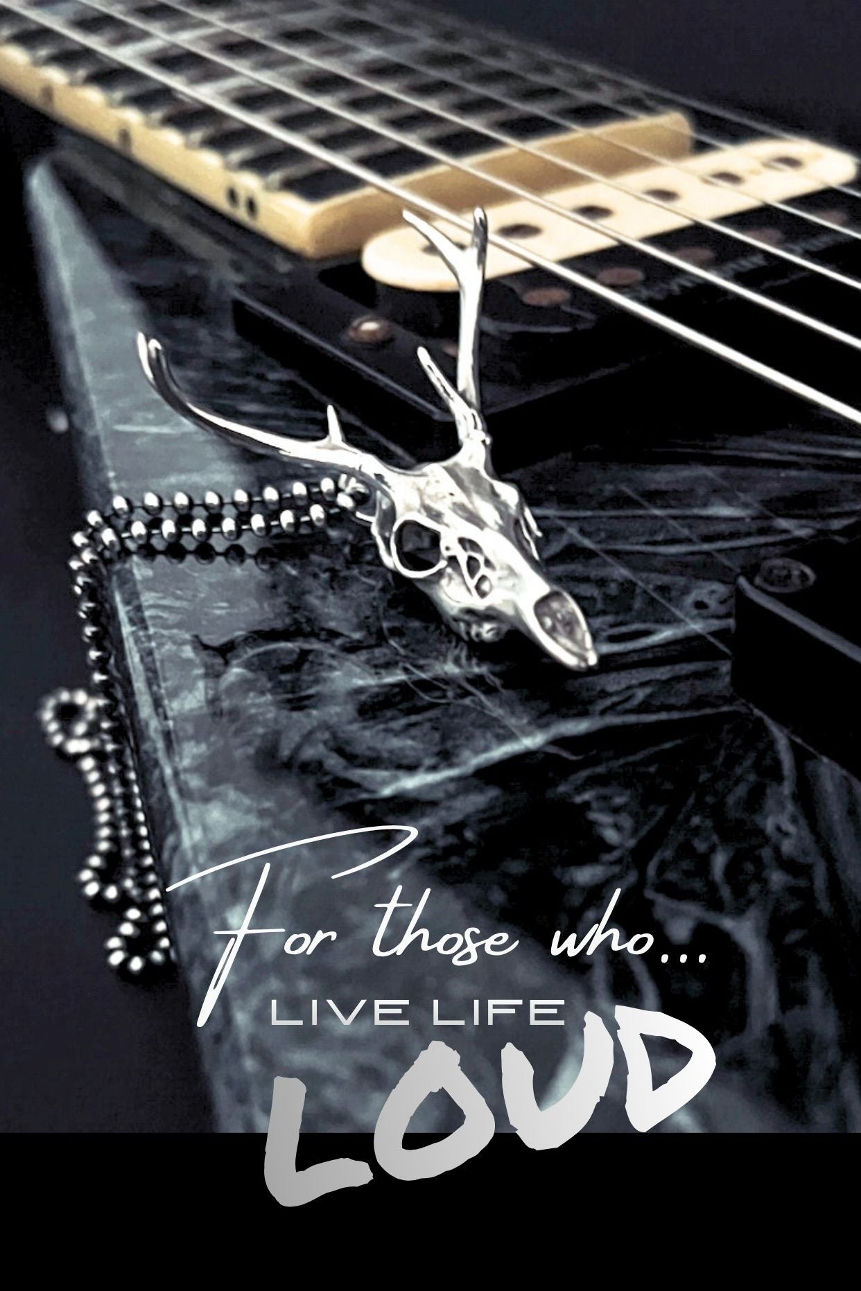 FAWN OF THE DEAD sterling silver deer skull pendant on Jackson V guitar with the caption 'For those who live life loud'