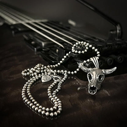 NO BS bull skull on 2.5mm ball chain. Photographed on a ESP guitar 