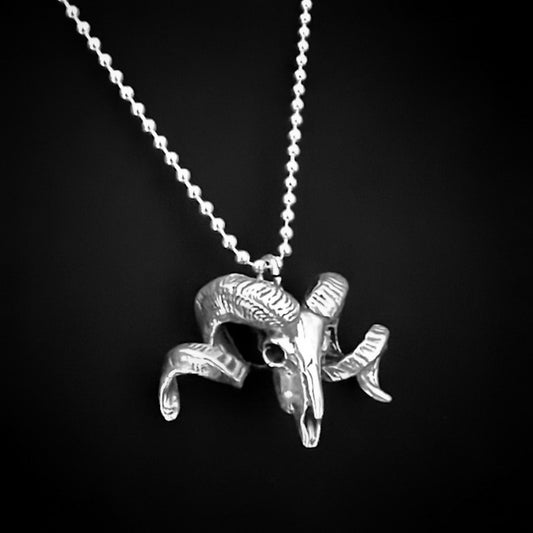 Sterling silver NO FLOCKS GIVEN ram skull pendant on ball chain, photographed on black background
