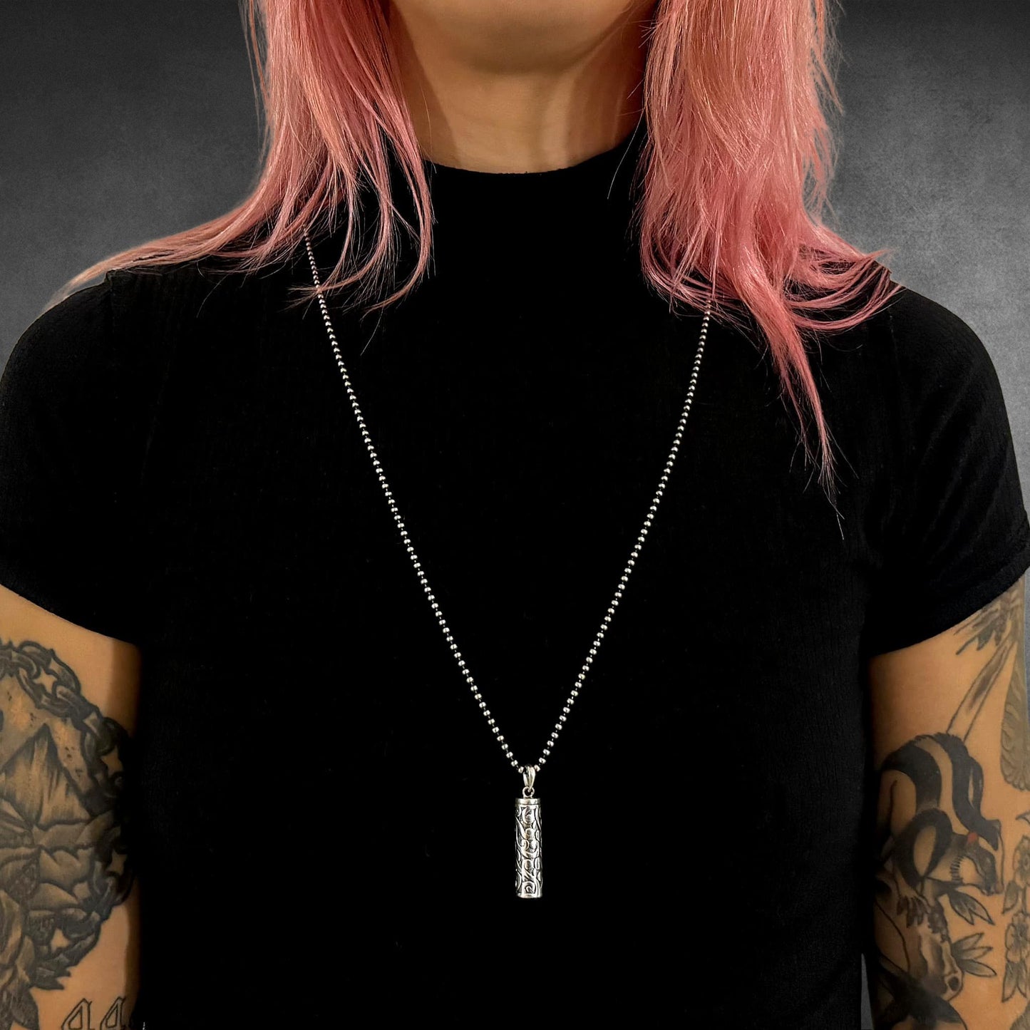 POISON IS THE CURE on 2.5mm oxidised 28-inch 2.5mm ball chain, worn by tattooed model
