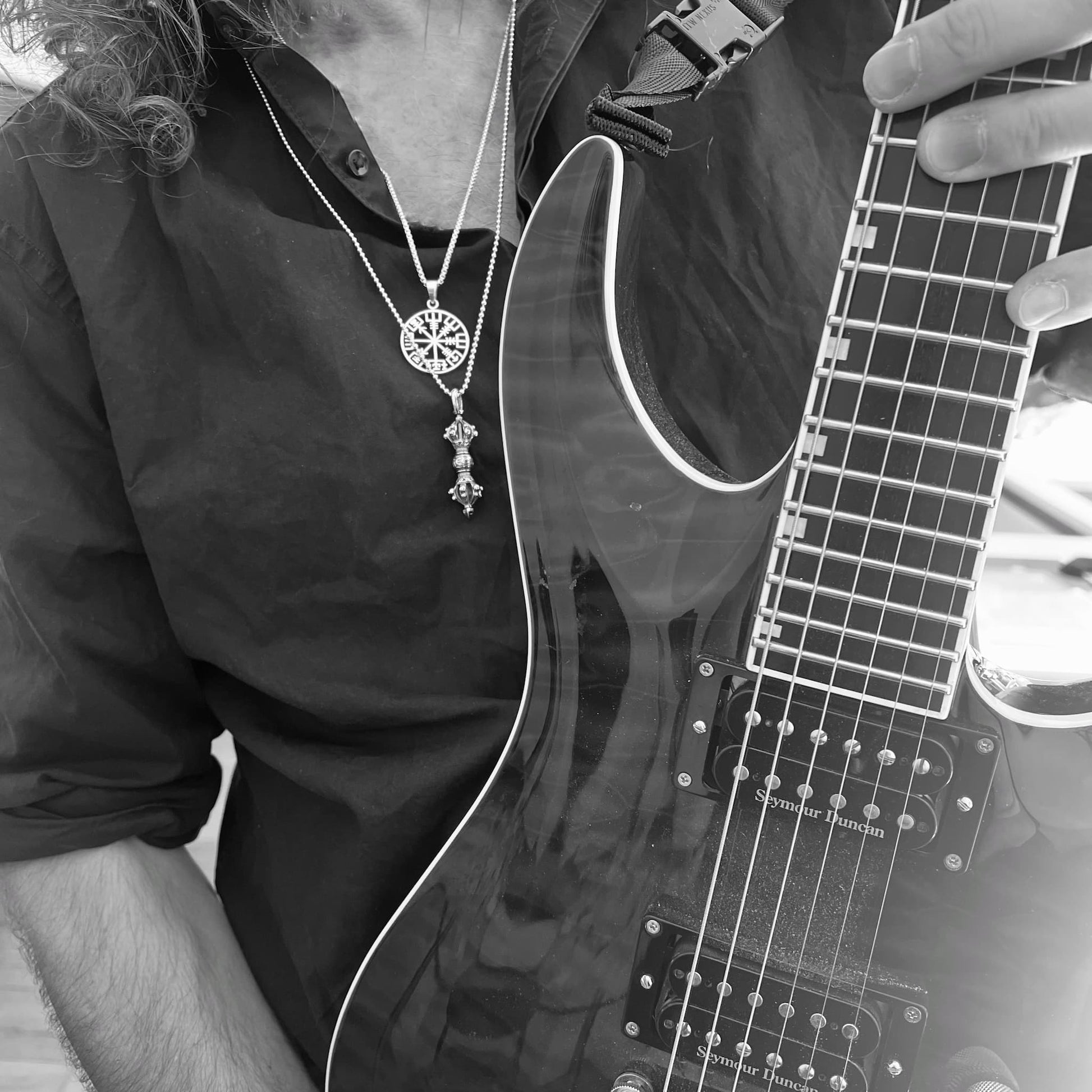 A cool rockstar clutching a beloved ESP Horizon guitar. Wearing the RECKLESS ROUTE to guide him, yet possibly cursed by the WARBORN RELIC. A doomed pairing that could leave the wearer forever chasing control while hammering the self-sabotage button on repeat. Still — looks nice though. 