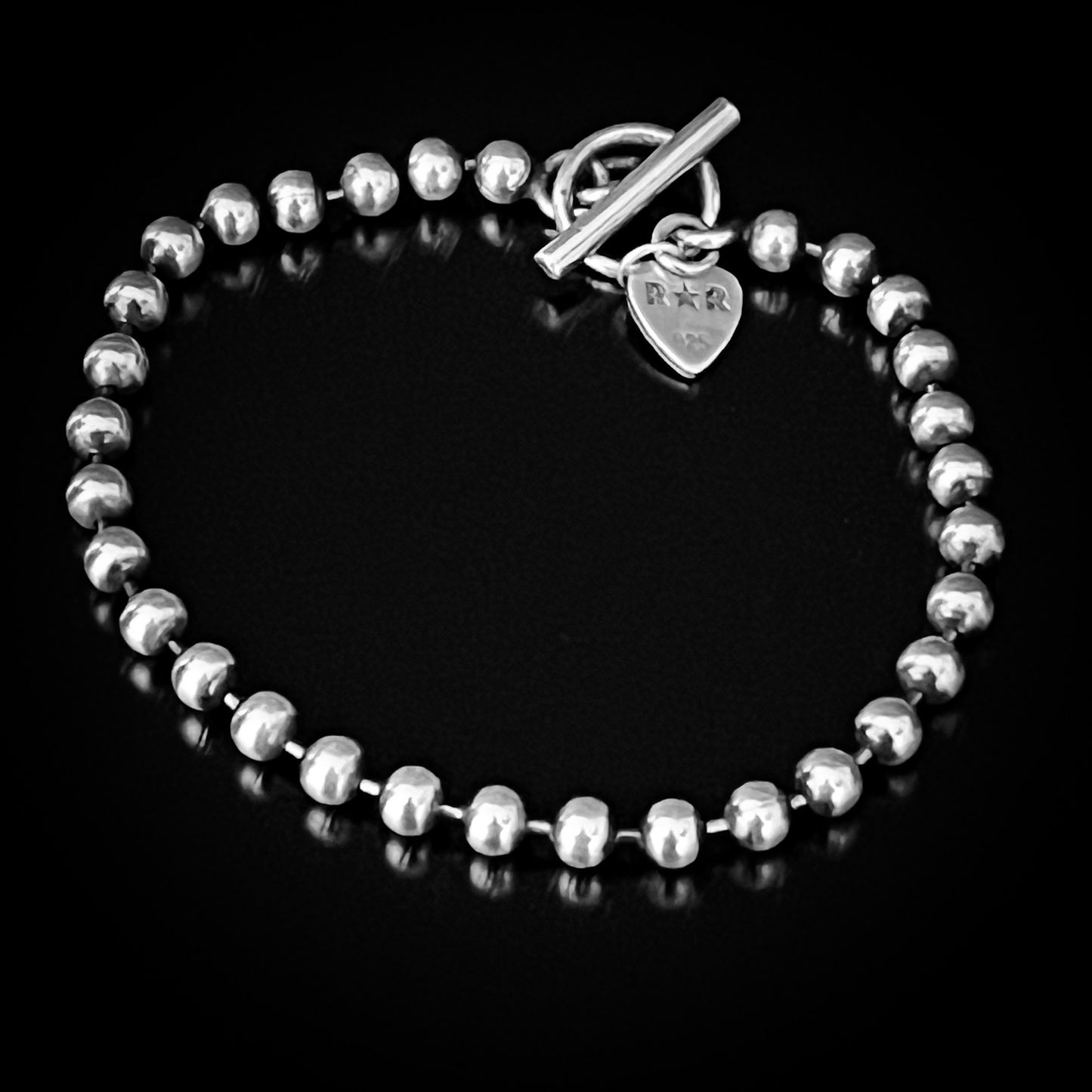 SIDEKICK SLAYER oxidised sterling silver bracelet by ROCKSTAR★REFINEMENTS™. Photographed on plain black background. 