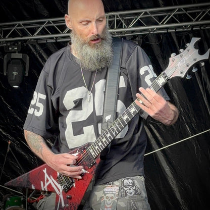 Stuart "Rage" Dixon performing with Live Undead, wearing the ROCKSTAR★REFINEMENTS™ 'ANTIDOTE (NOT INCLUDED) pendant on stage.