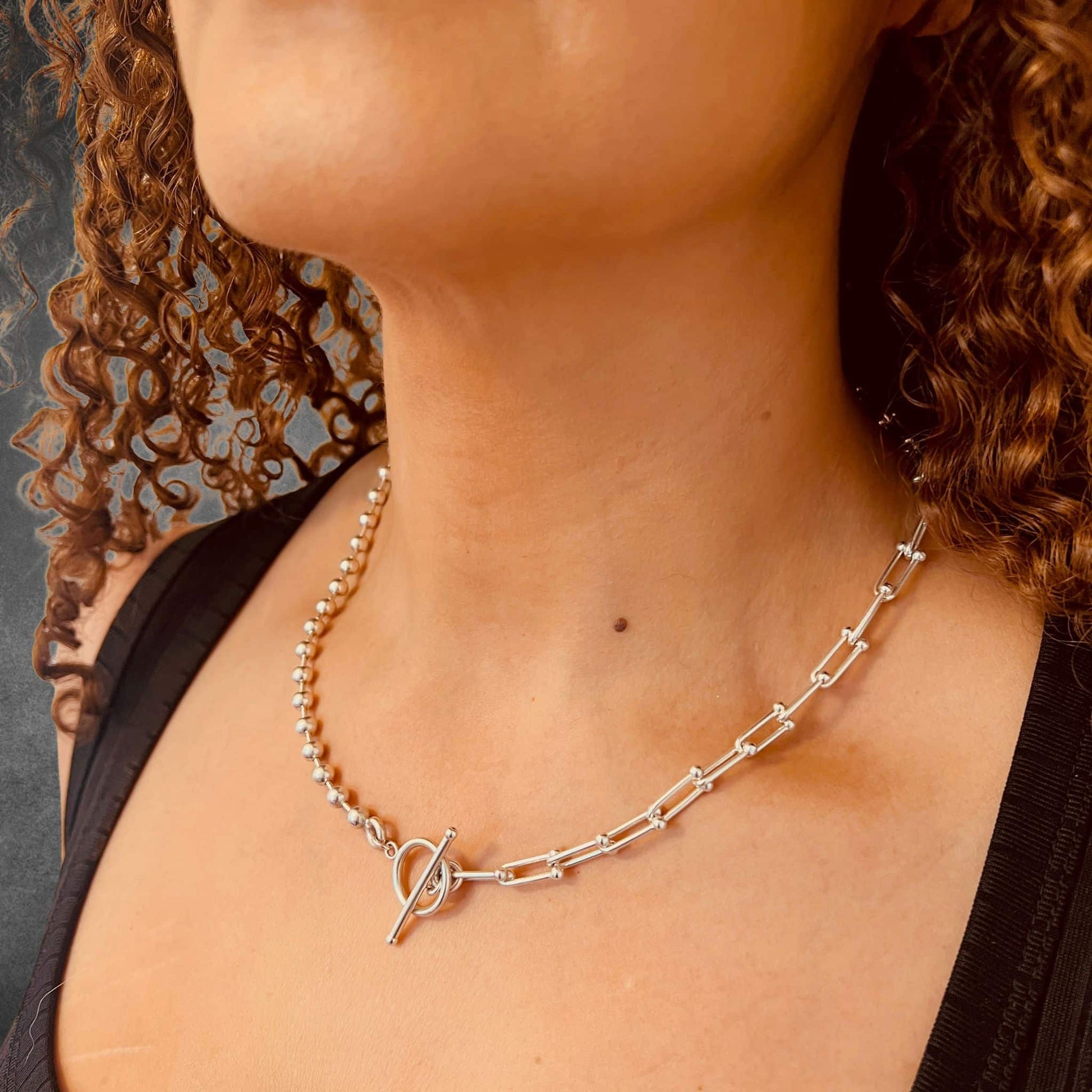 Model wearing SYNCED sterling silver necklace by ROCKSTAR★REFINEMENTS™ 