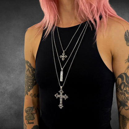THE OUTLAW'S CROSS worn in a layered look with ALTAR EGO and POISON IS THE CURE. Blessed be the pink-haired model.