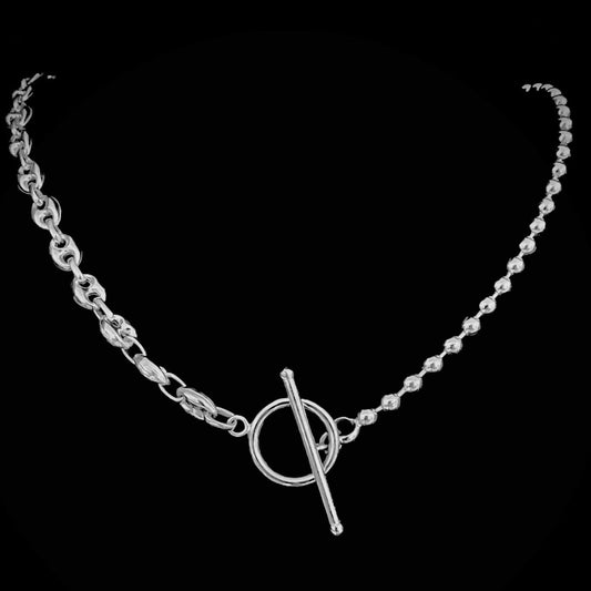 TRANSITION - sterling silver anchor and ball chain DUALITY necklace with toggle clasp, close up on a black background.