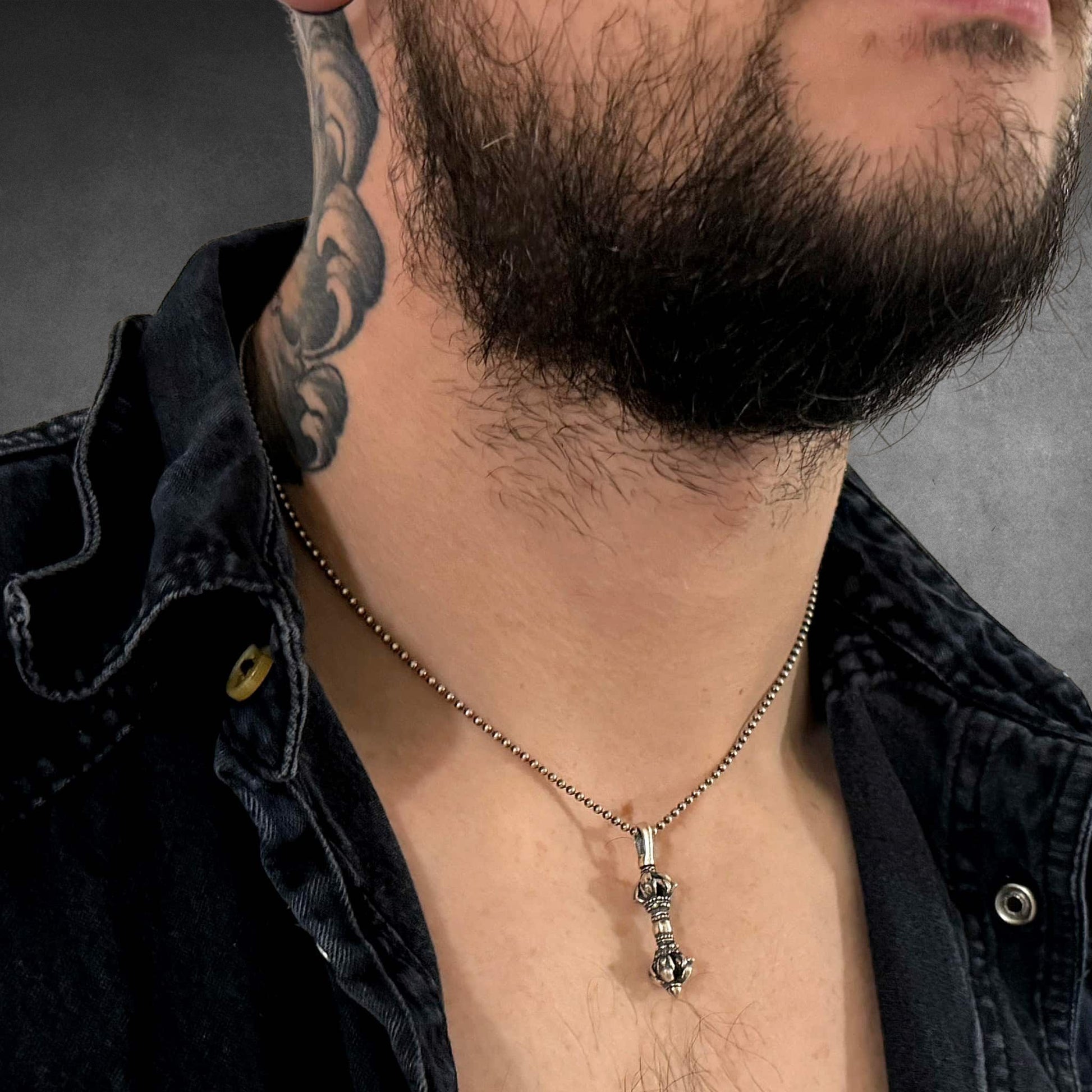 Model wearing The lesser cursed WARBORN MINI on 18-inch oxidised ball chain