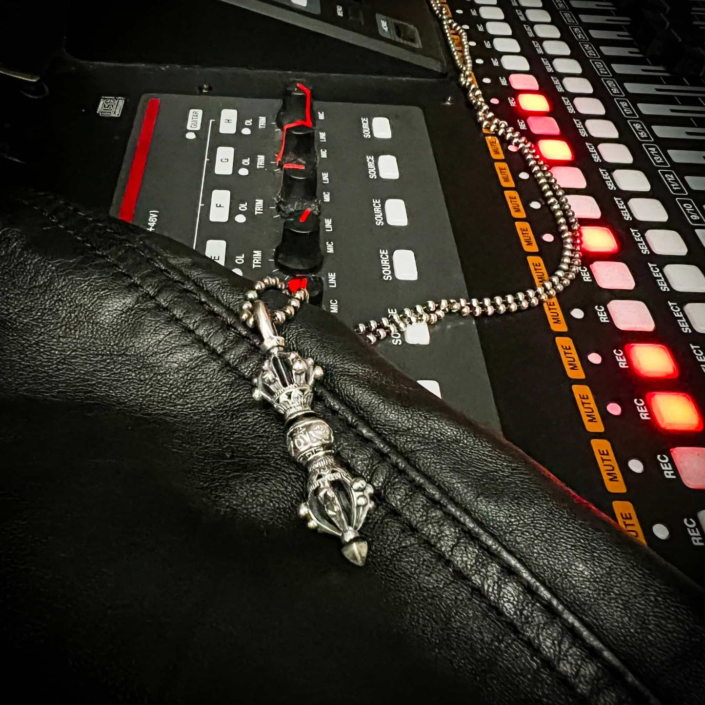 STUDIO shot of the WARBORN RELIC on a leather jacket lay on the recording desk