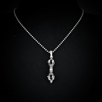 The WARBORN MINI on 18-inch ball chain, photographed on black background