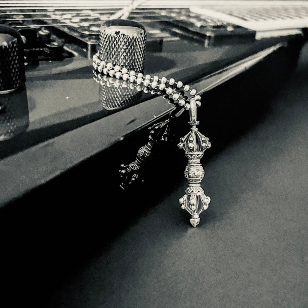 The WARBORN RELIC hanging off a Jackson KV2 guitar. Black and white photography.